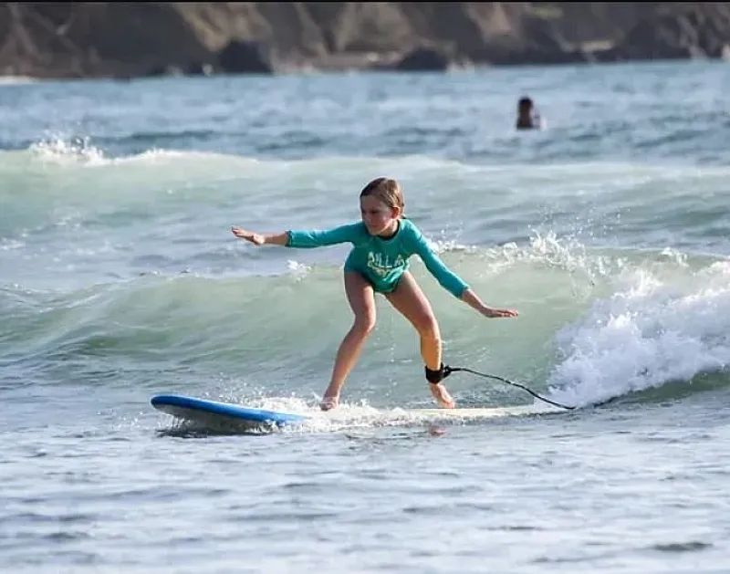 kid surfing jaco beach costa rica