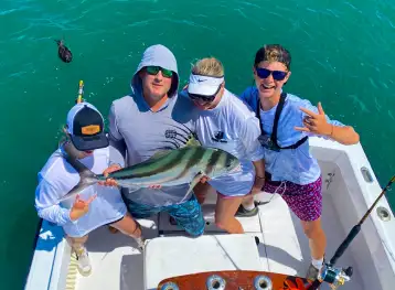 A corporate group on a private boat charter for a team-building event in Jacó.