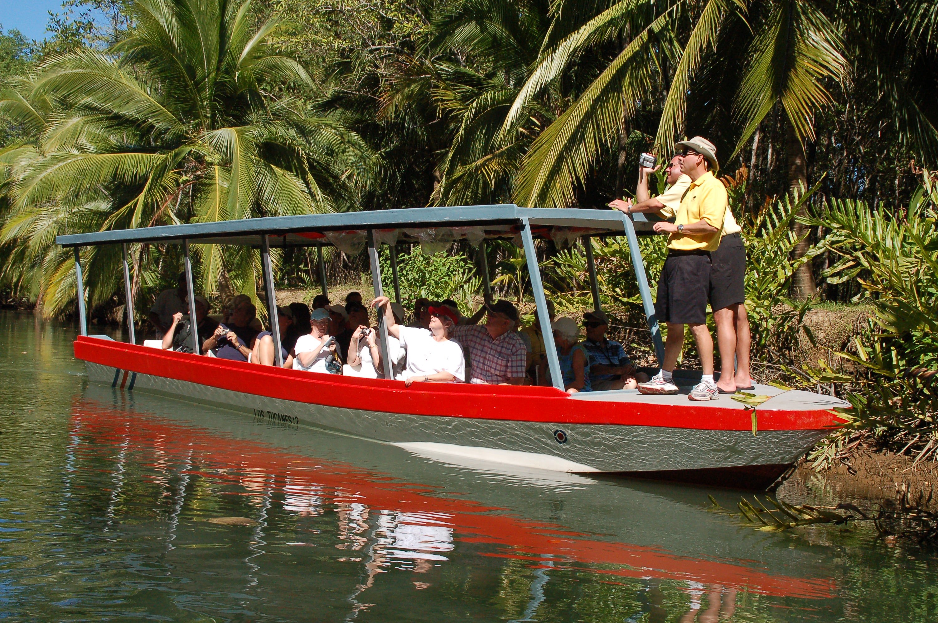 Family on a calm mangrove boat tour on Damas Island near Manuel Antonio, Costa Rica
