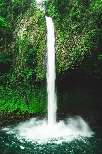 La Fortuna Waterfall cascade dropping 246 feet into a blue pool in Costa Rica